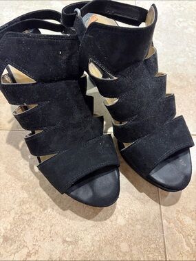 Well worn black platform heels